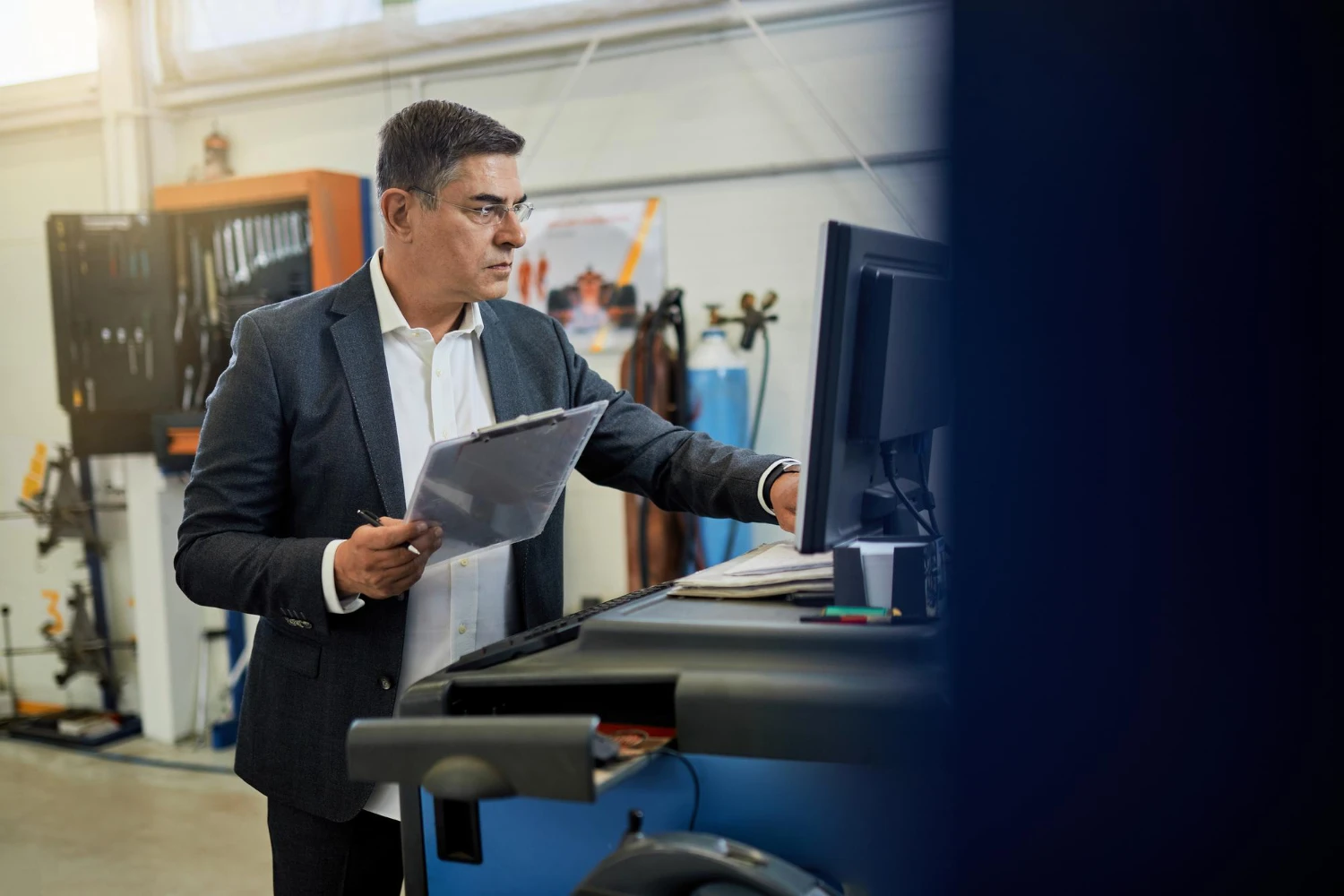 Service business owner reviewing automated candidate screening results
