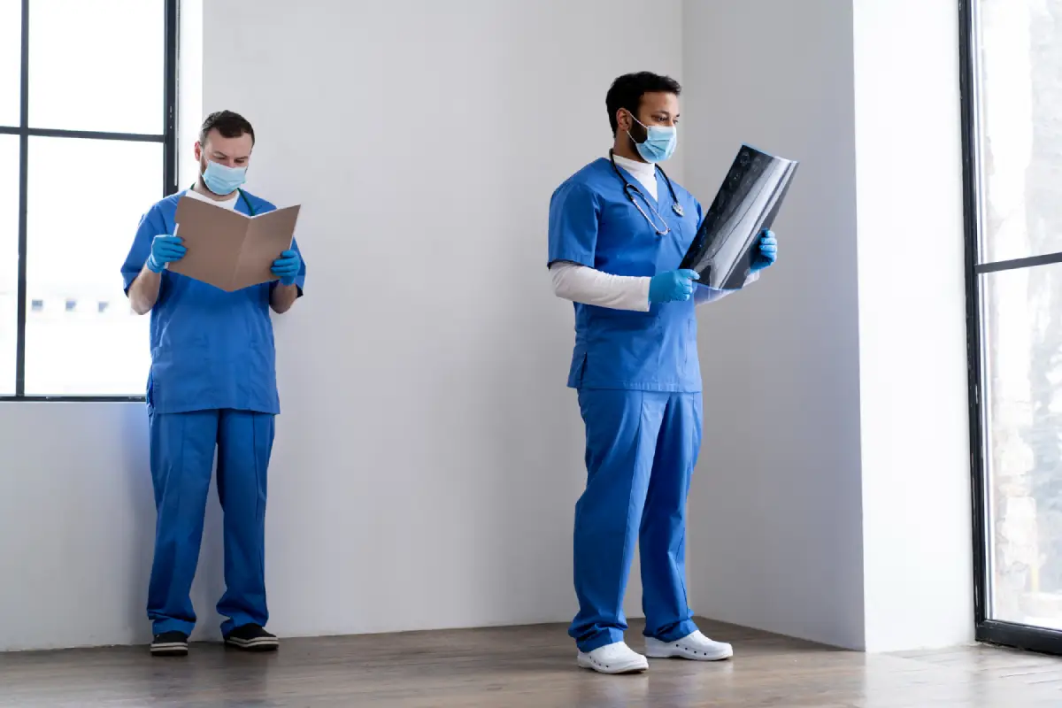 A healthcare worker wearing scrubs and a mask, representing the challenges in the healthcare sector due to labor shortages.