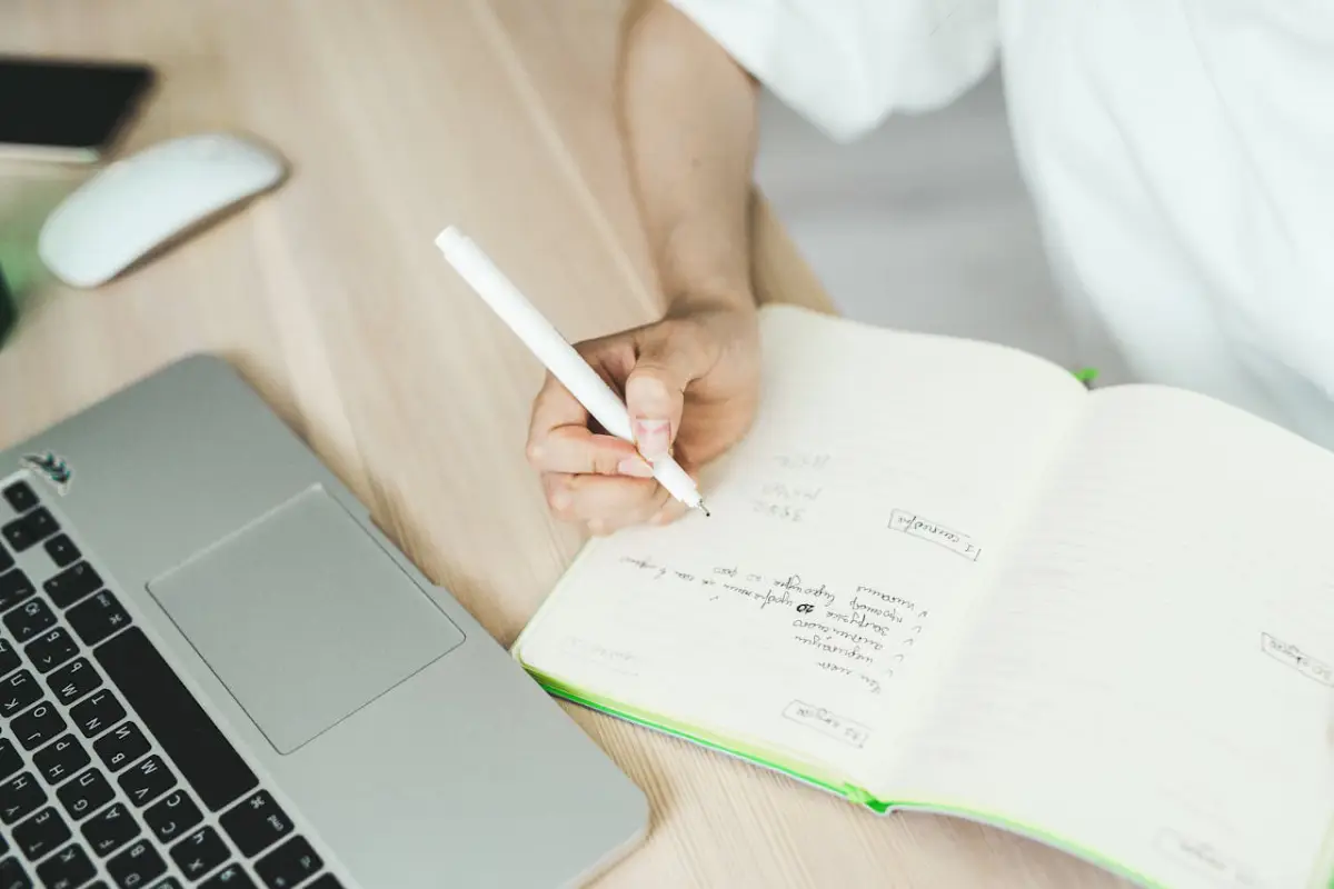 Notebook with handwritten digital marketing checklist