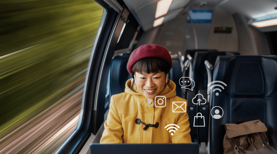 women in train on device smiling
