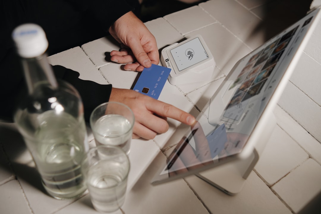 A person pays for their order on a tablet. Modern restaurant POS system in use