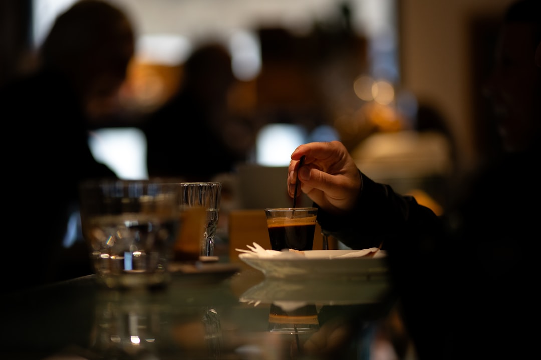 A person sitting at a table with a plate of food, representing great dining customer experience
