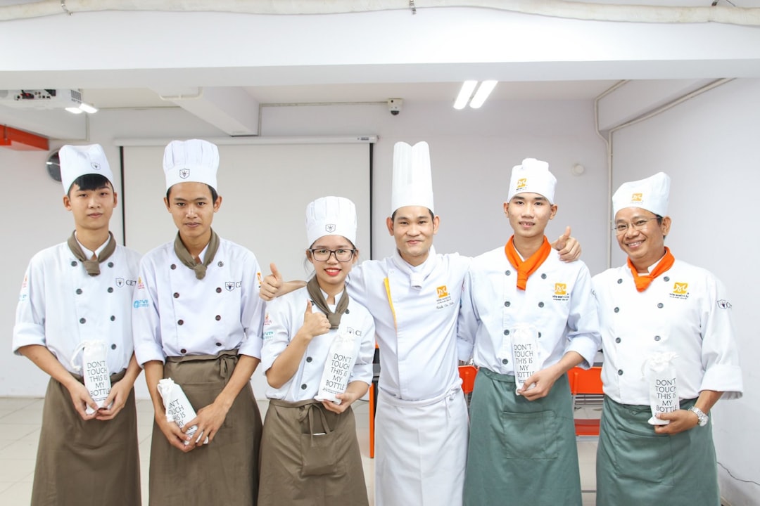Restaurant staff celebrating efficient operations with teamwork