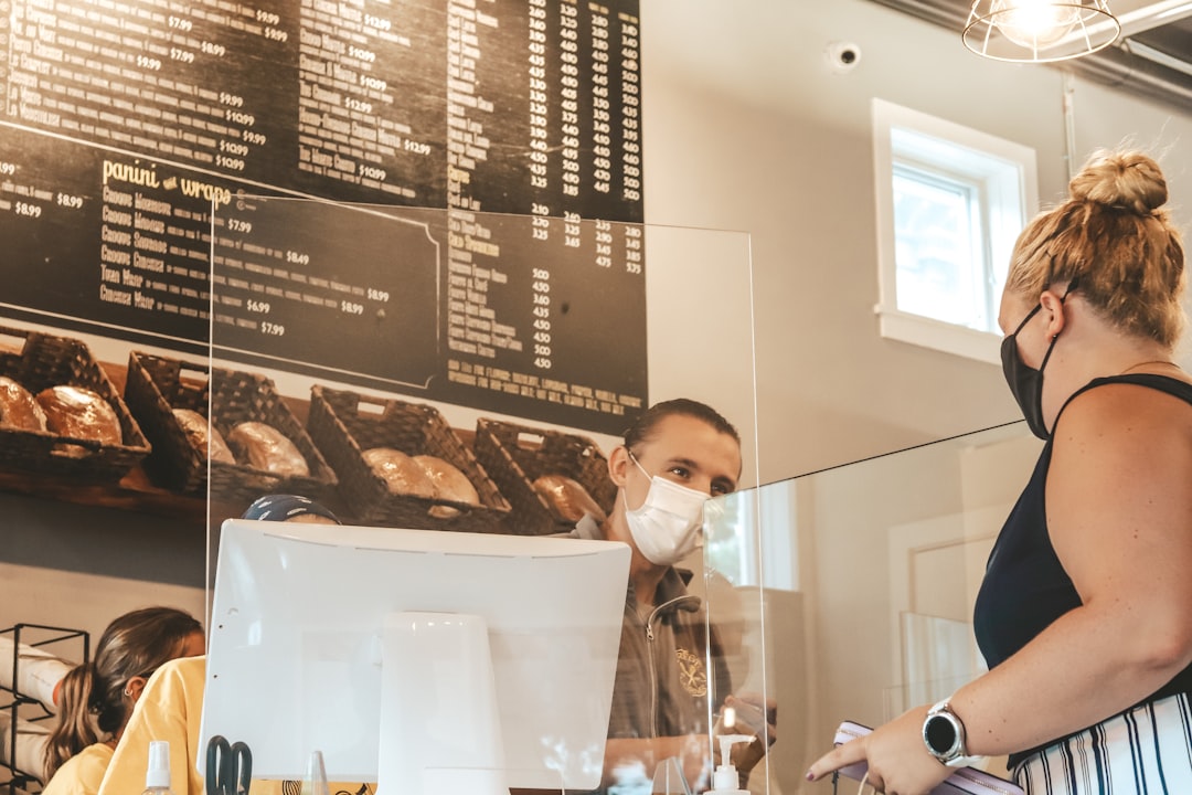 Customer checking out at the register at Crêpe Corner