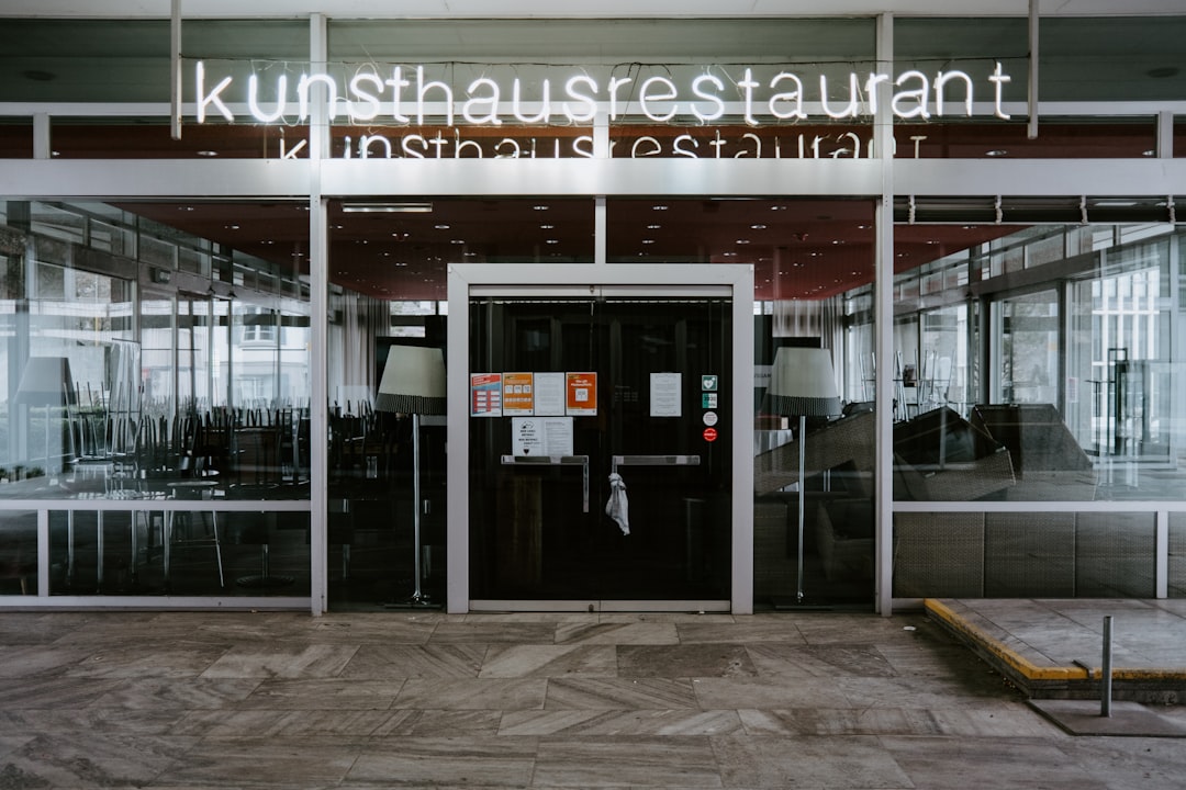 the entrance to a restaurant with glass doors representing digital integration