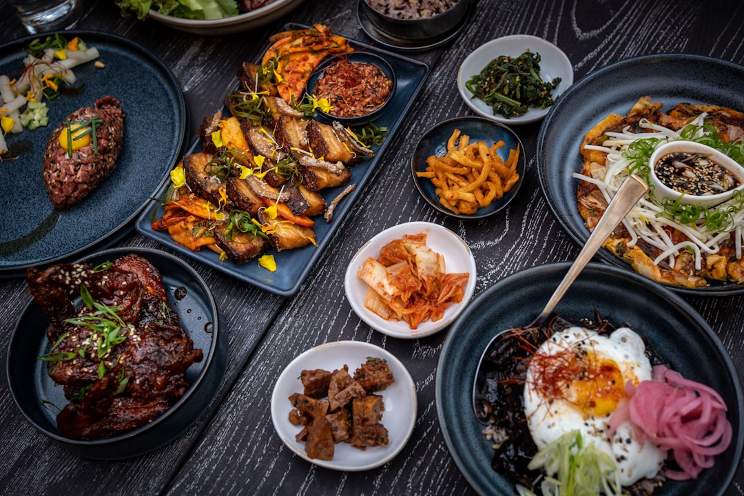 Table full of restaurant dishes showcasing menu items that should be indexed on HTML menu pages