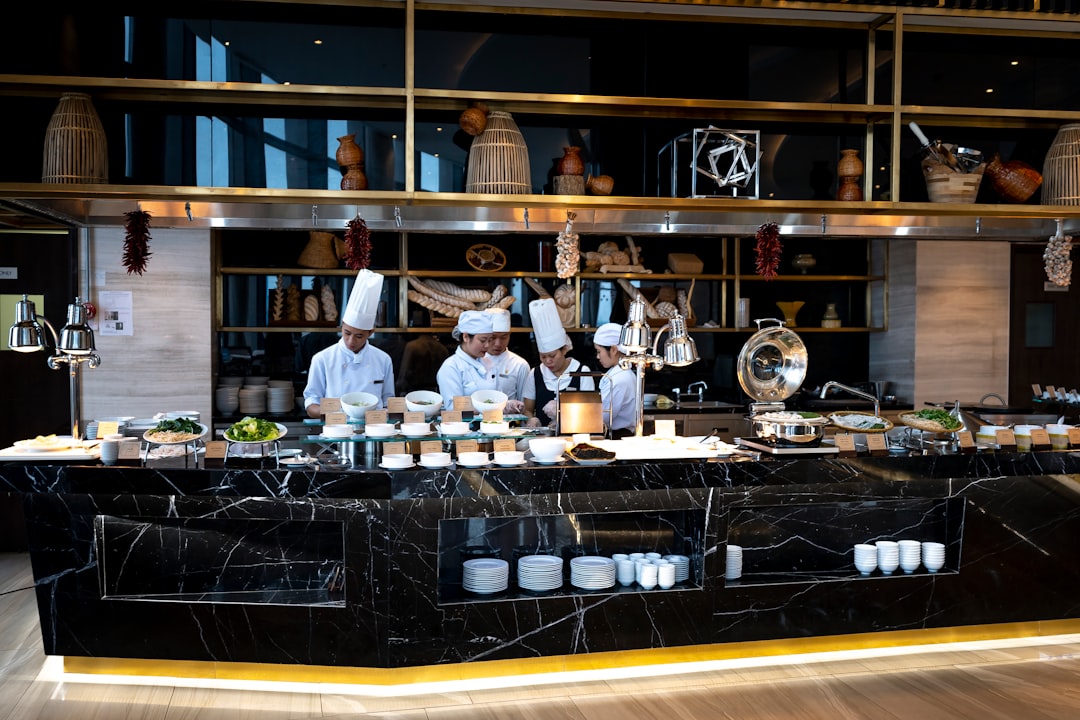 Chefs working an organized expo line with mise en place during service.