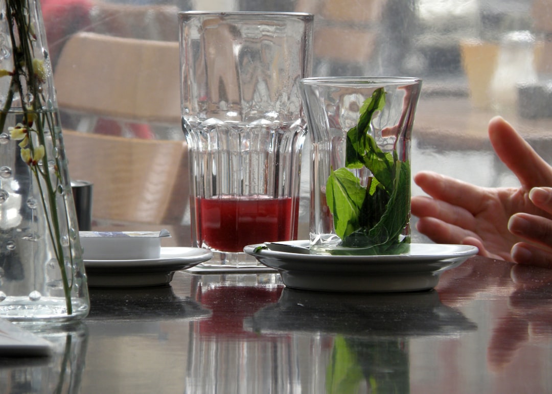Close-up of plated restaurant dishes and drinks on a table, styled for professional food photography