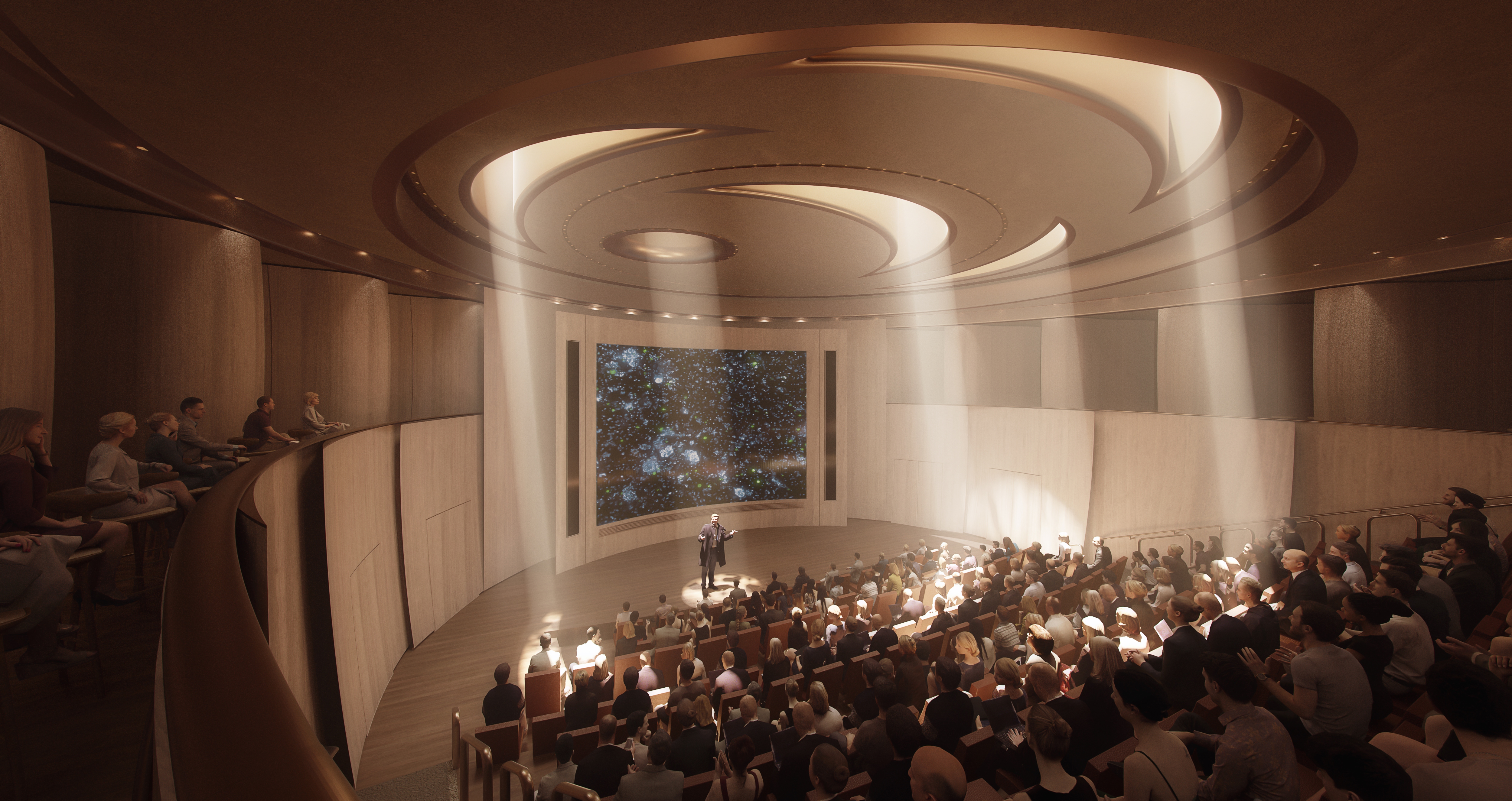 A speaker stands center stage in a sunlit, circular wood-paneled auditorium with tiered seating beneath concentric skylights, addressing a full audience at the Ellison Institute of Technology.