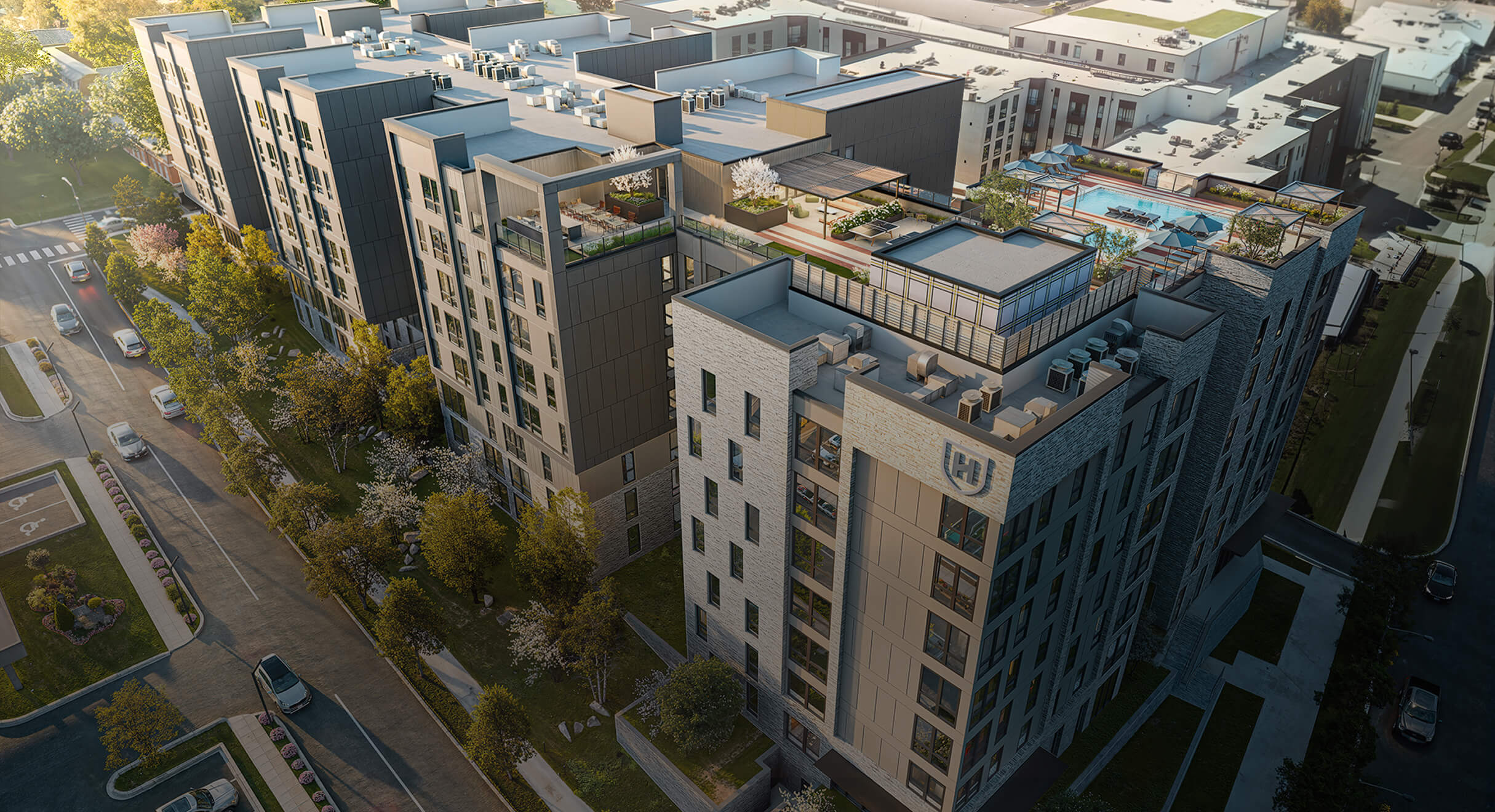 Student housing building rendering with rooftop amenities.