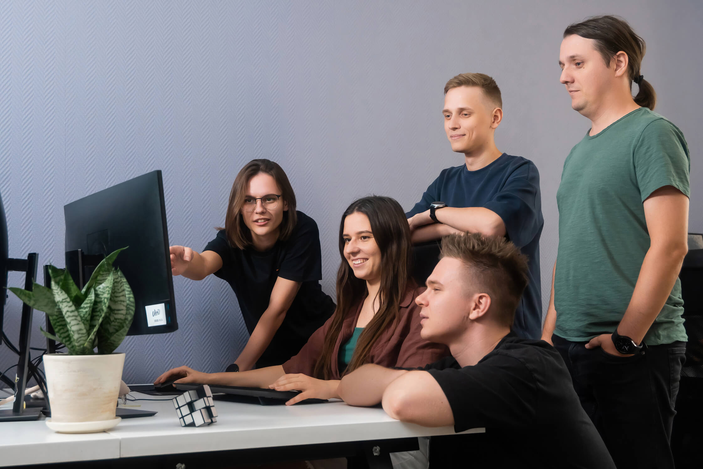 The View team in the office, reviewing a project.
