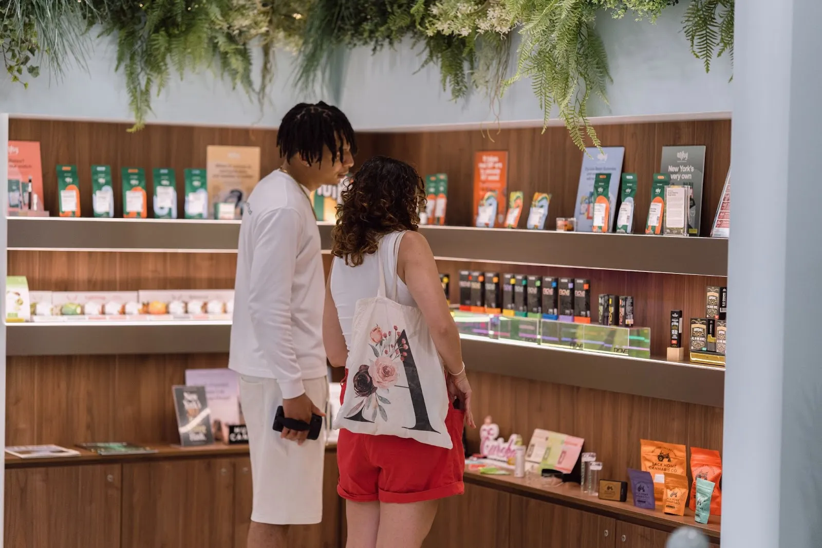 Customers looking at products in The Alchemy dispensary. 