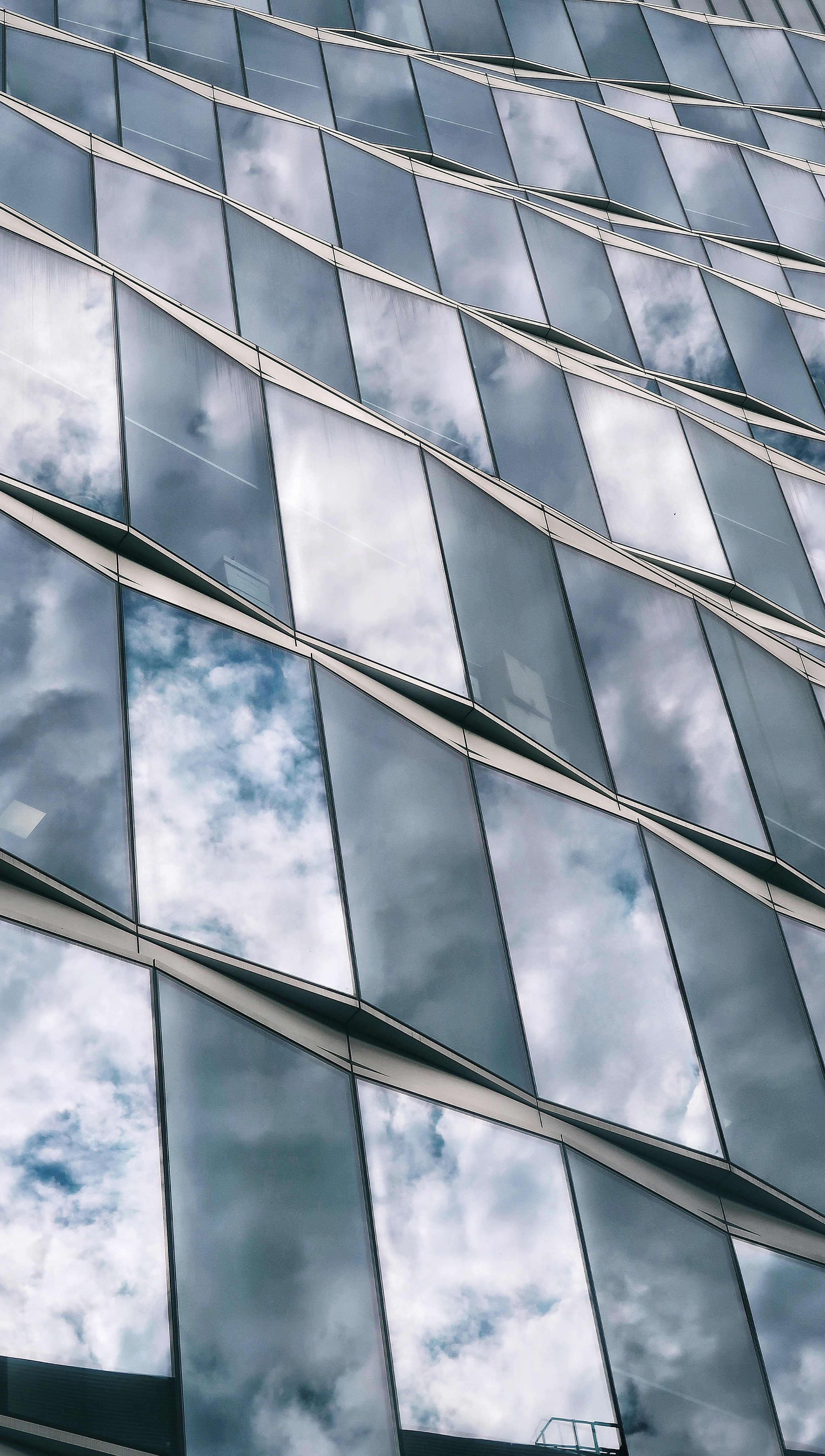 Transparent glass panels set against the sky