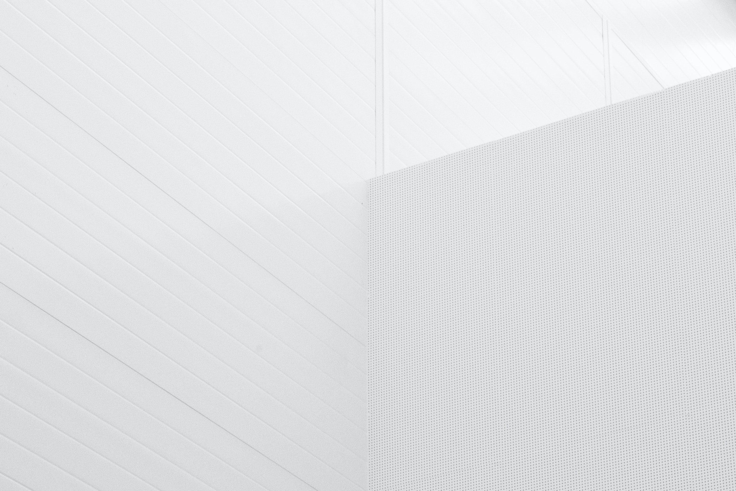 White architectural walls of a modern building with clean lines and geometric design.