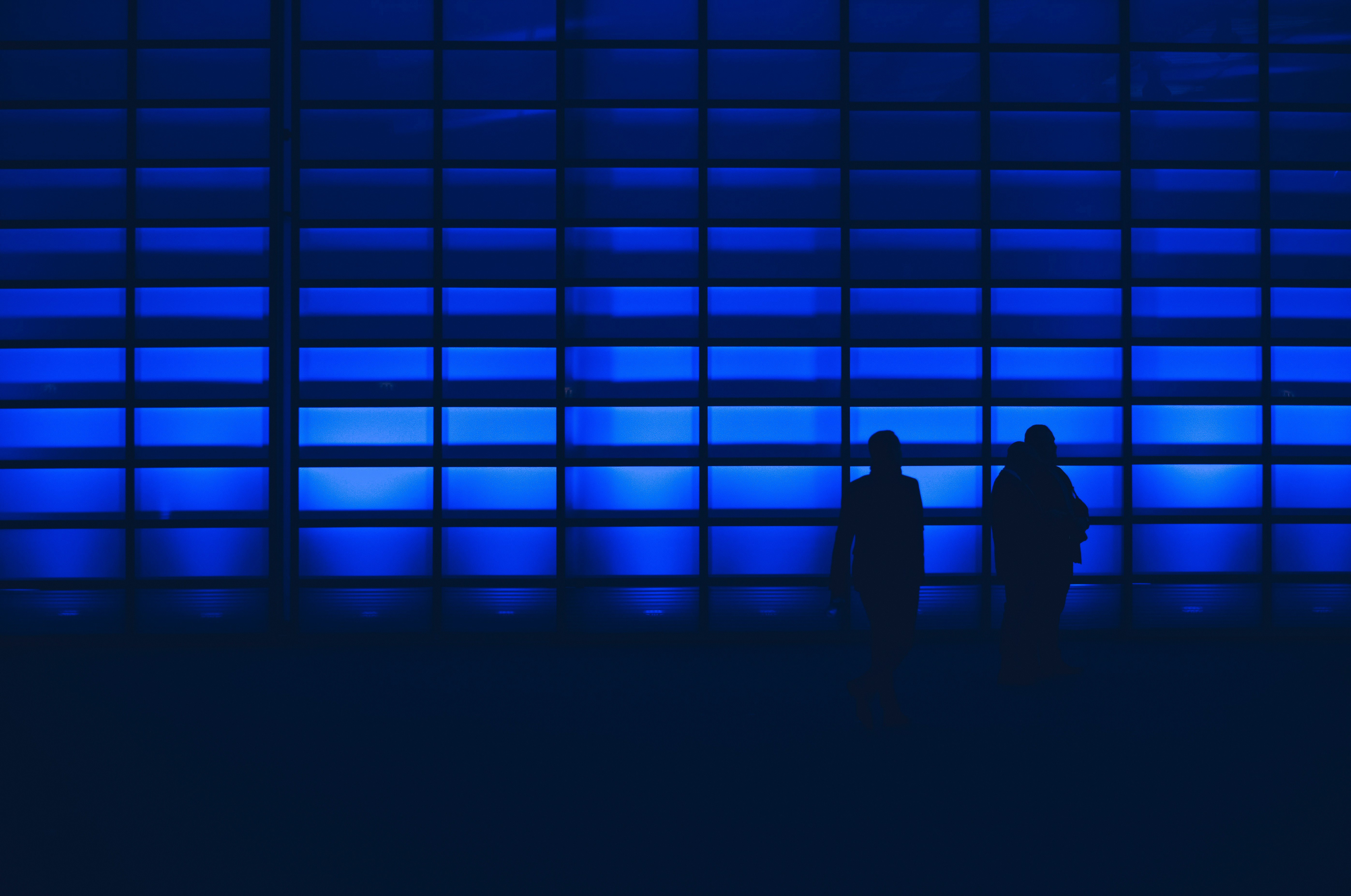 Blue background with profile of people