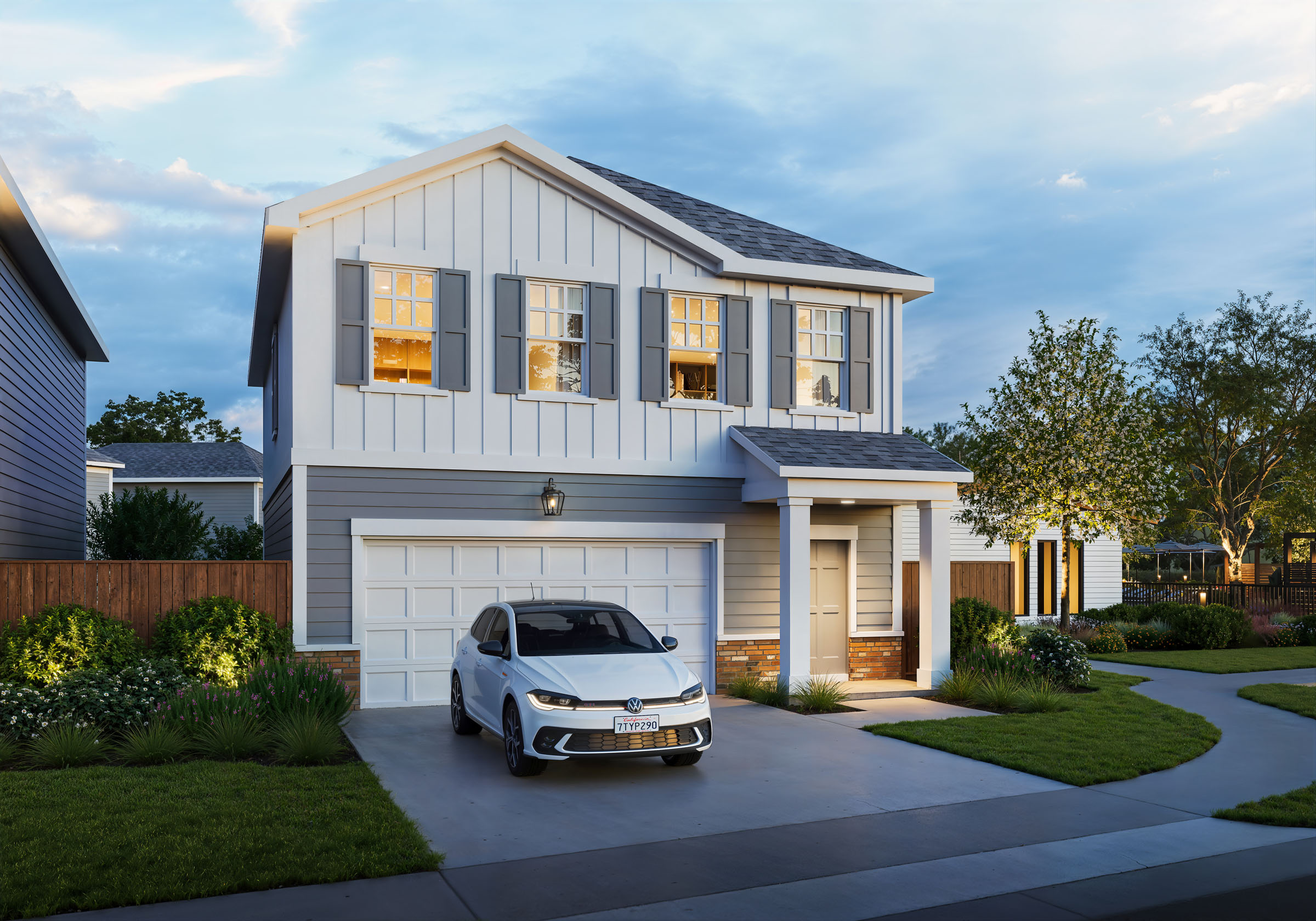 Modern single-family home exterior with landscaped entry and driveway.