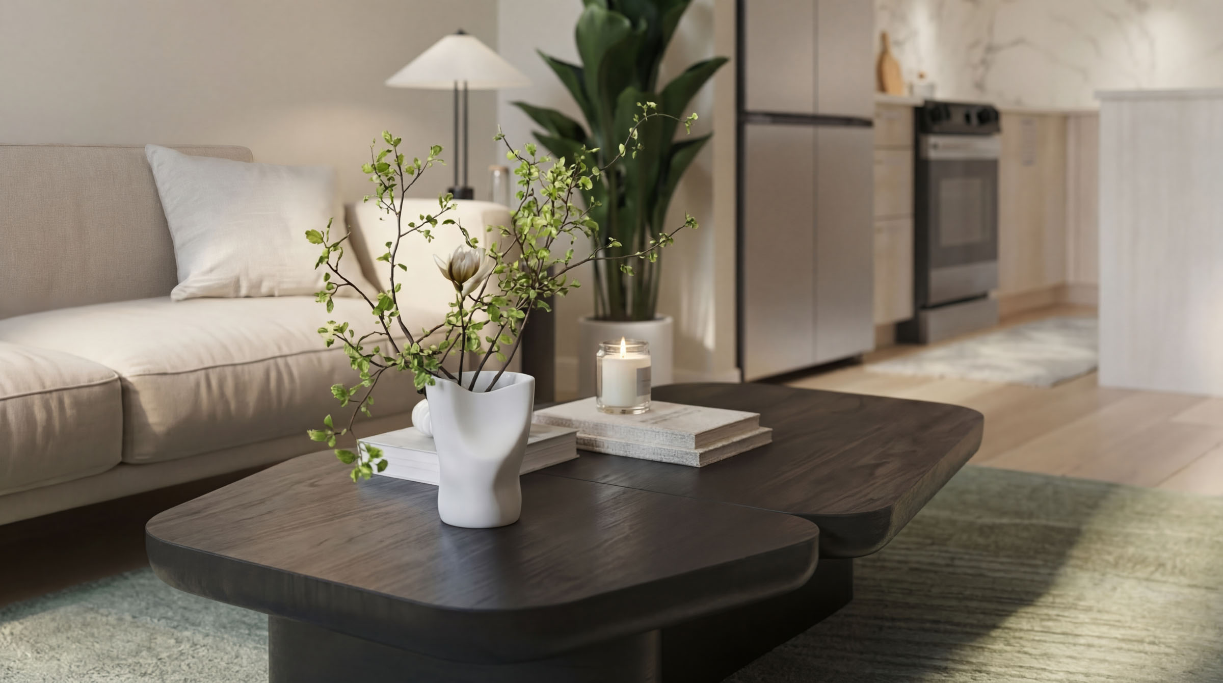 Bright living room with neutral sofa, coffee table, and indoor plants.