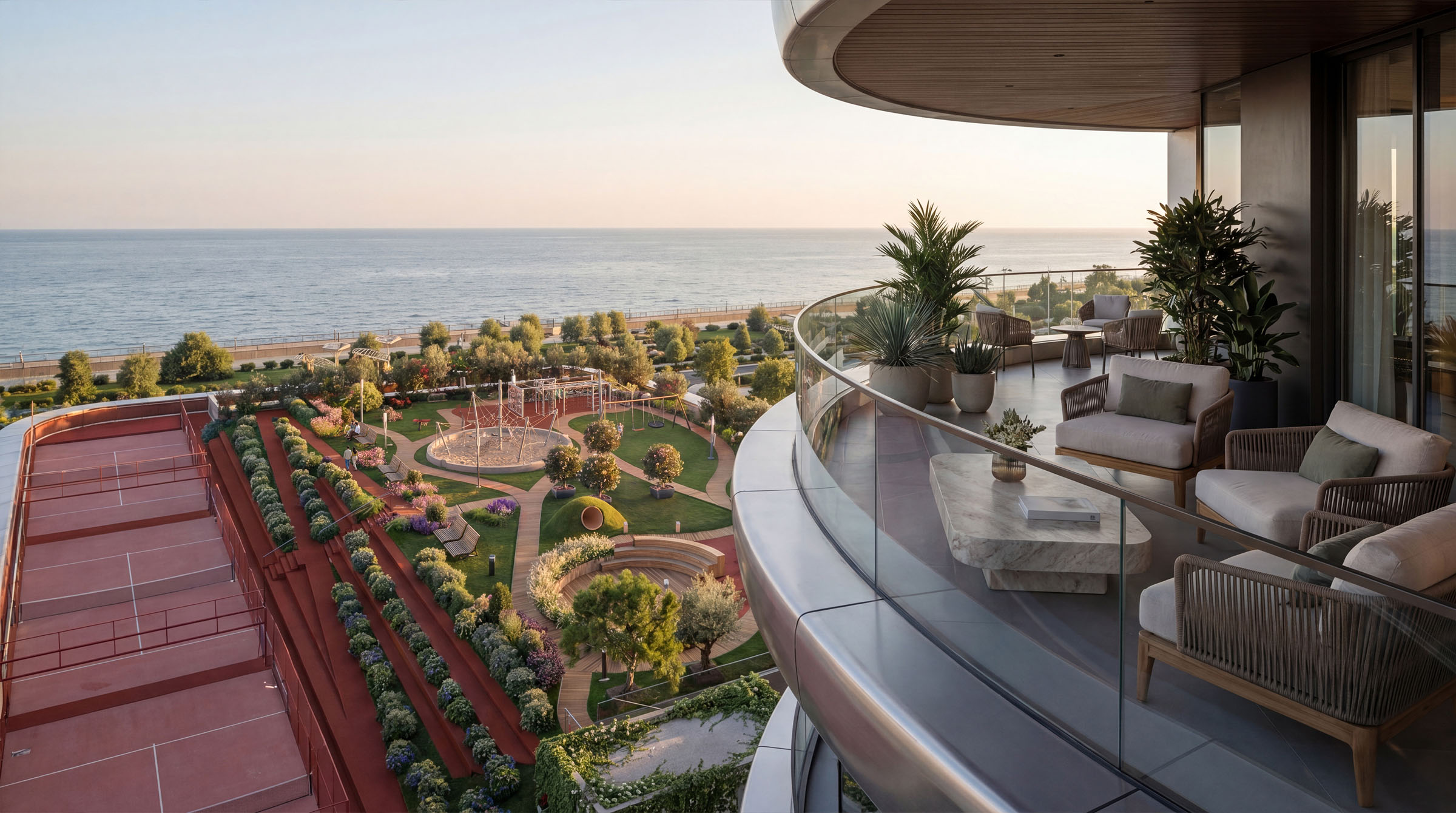 Ocean-view balcony lounge with outdoor seating and landscaped terrace below.