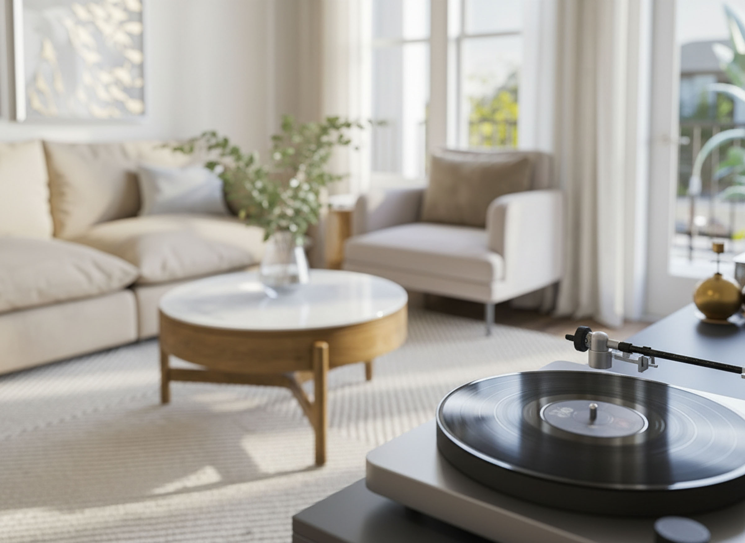 Sunlit living room with cream seating, round coffee table, and soft natural decor.
