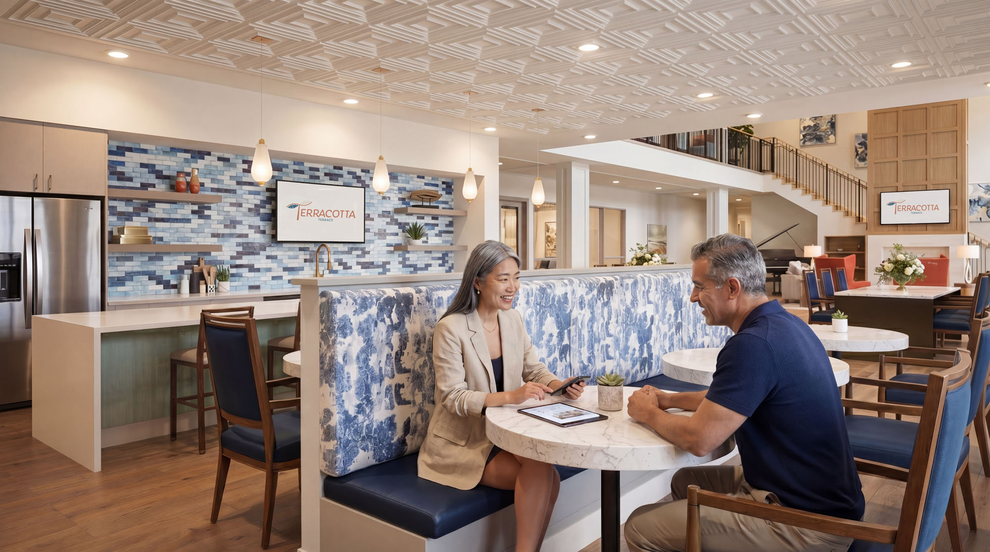Lifestyle rendering of residents working together in a clubhouse lounge at Terracotta Terrace.