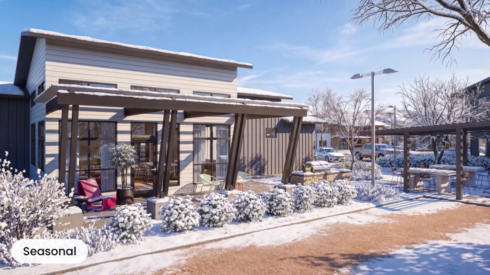 Residential clubhouse and landscaping covered in winter snow