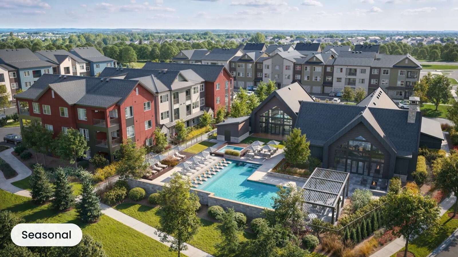 Aerial view of a residential community with a central pool