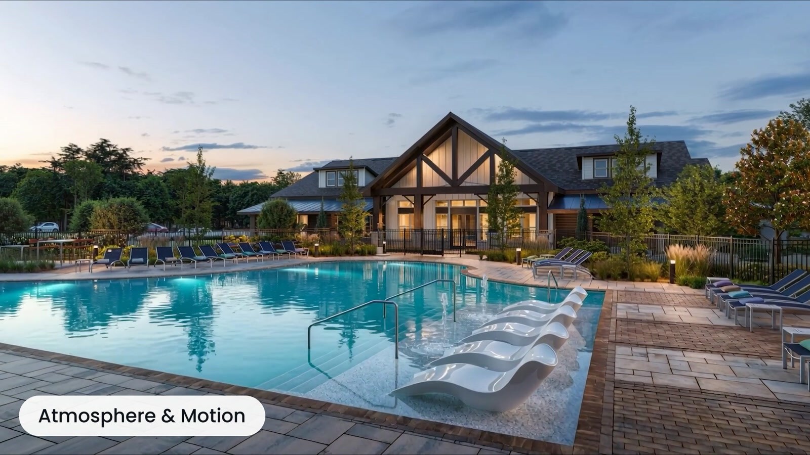 Resort-style residential pool and clubhouse at sunset