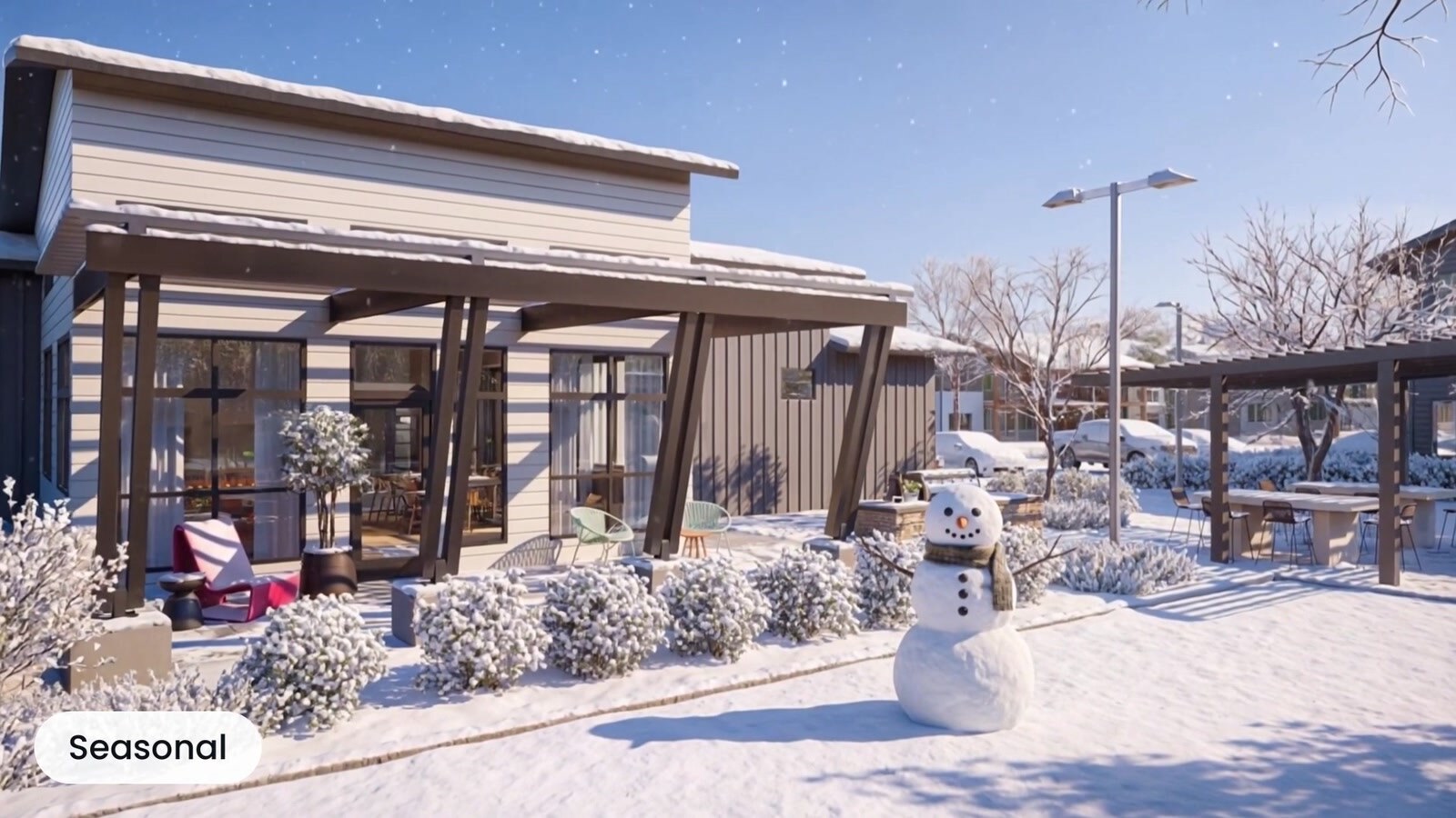 Residential clubhouse and outdoor seating surrounded by winter snow