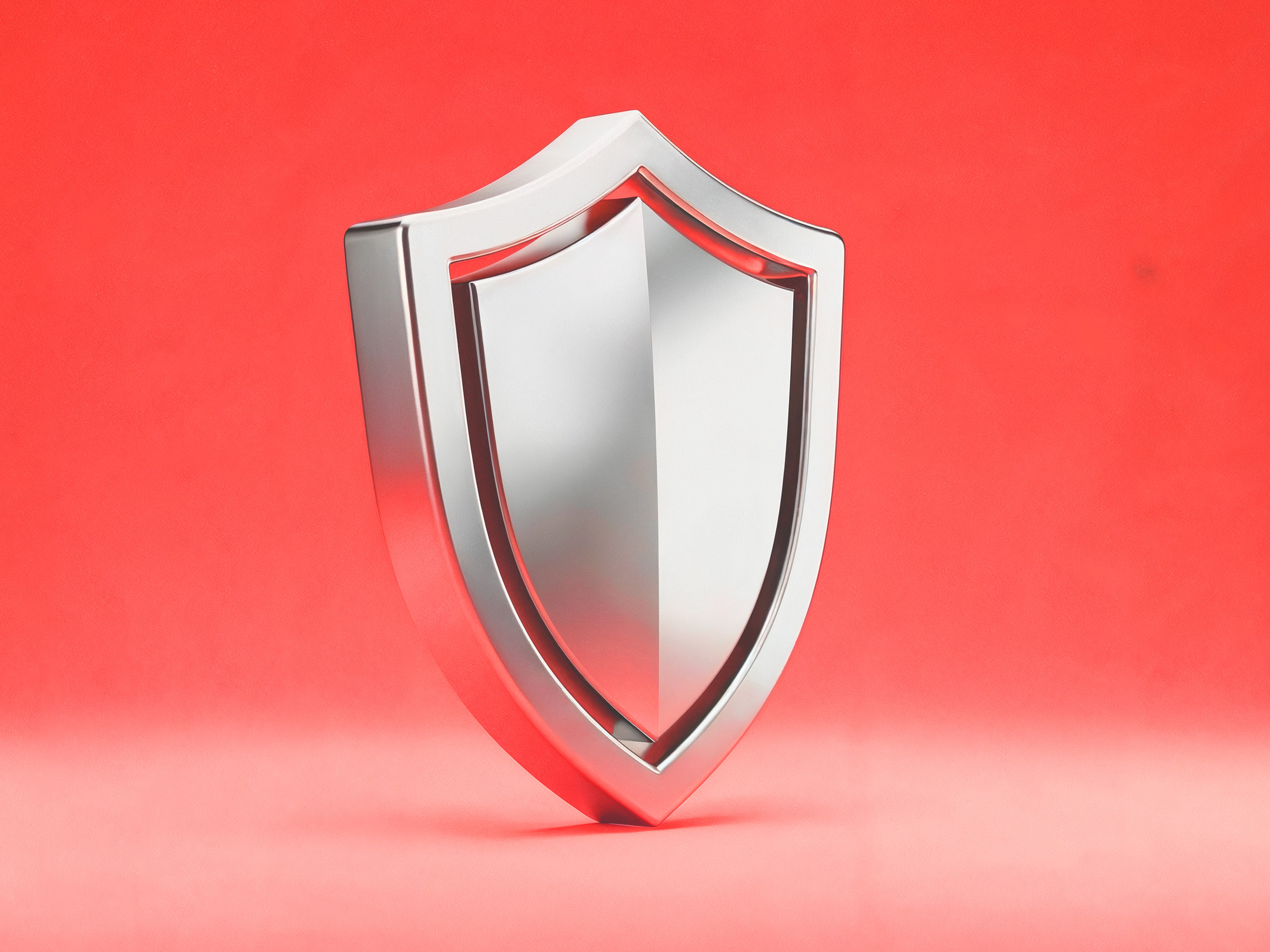 Metal shield symbolising how traders can protect capital by balancing risk and reward effectively in their trading strategy.