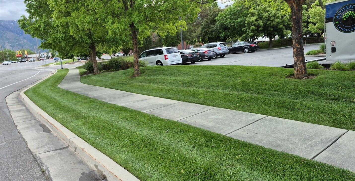 Freshly edged commercial lawn in Taylorsville maintained by Activescapes Landscaping with curb appeal and safety in focus