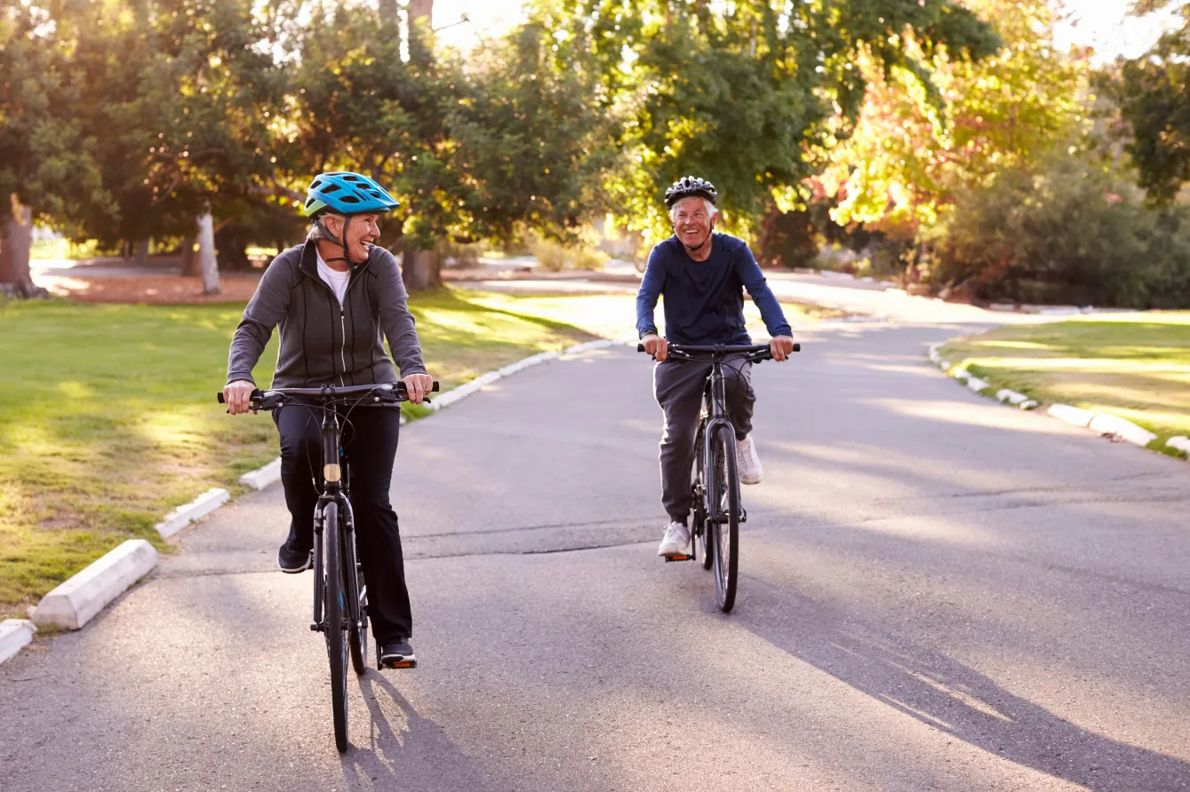 seniors riding bikes stock image