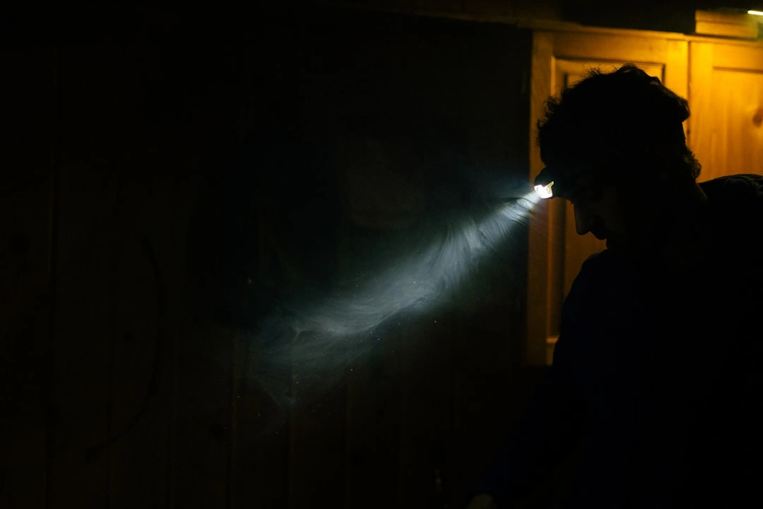 Homeowner performing the light test on an HVAC filter to check for clogs - how often should you change your hvac air filter