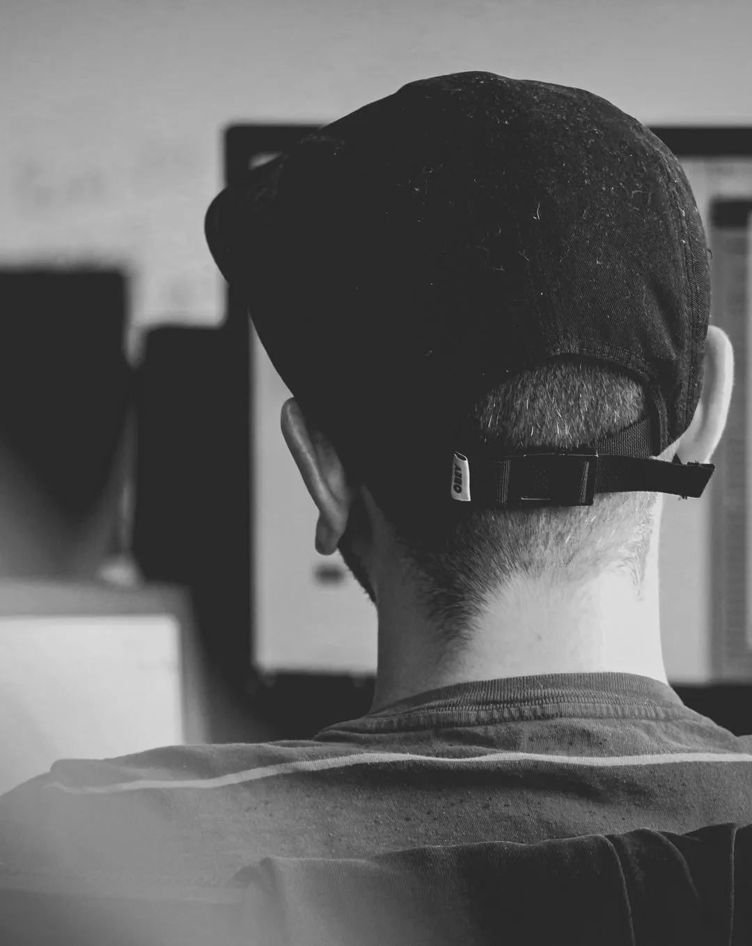 Back of persons head at computer