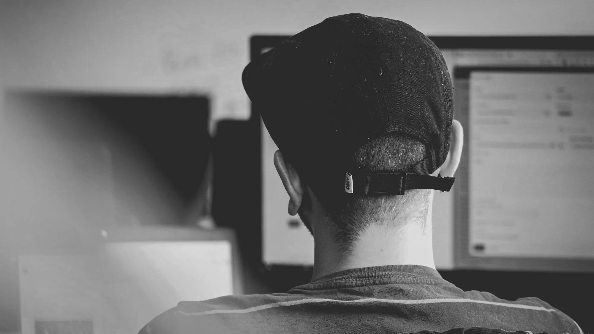 Back of persons head at computer