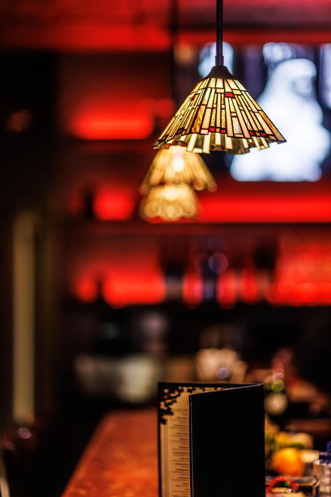 Soft lighting over a table setting with menu on table