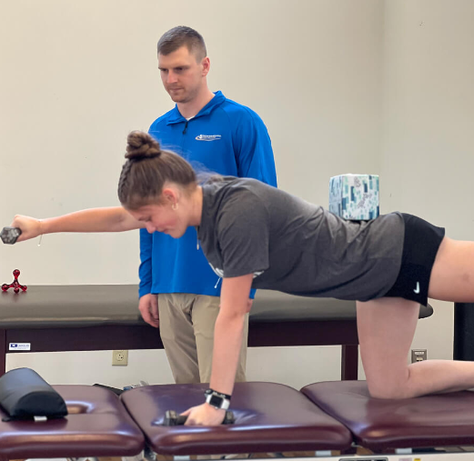 Patient working with a provider at a performance training clinic in Wexford, PA during a strength and conditioning session after completing physical therapy