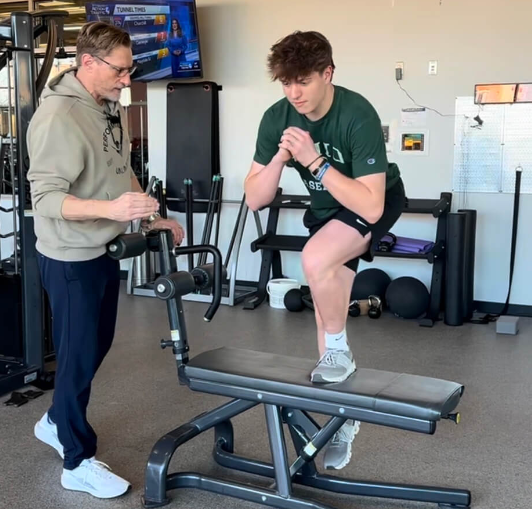 Patient working with a provider at a physical therapy clinic in Wexford, PA during a functional movement assessment session