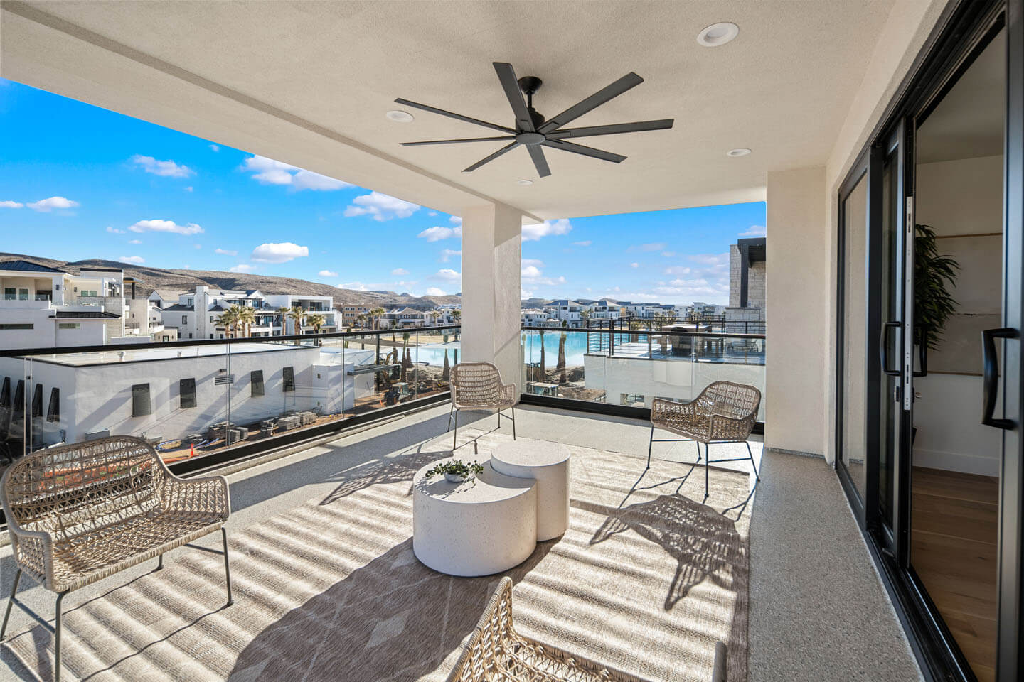 Photo of a balcony with black ceiling fan