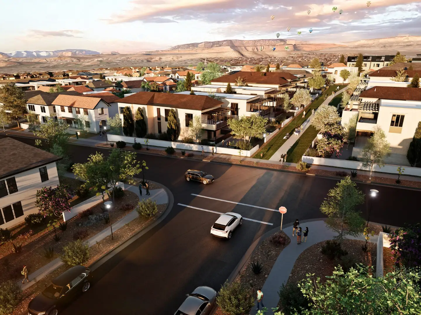 Aerial rendering of a desert neighborhood with tree-lined streets, mixed residential buildings, and dramatic sunset over distant mesas.