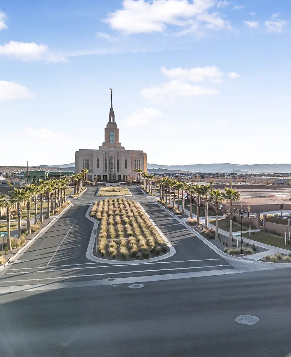 Palm-lined boulevard leading to temple with Summit View luxury homes along the street