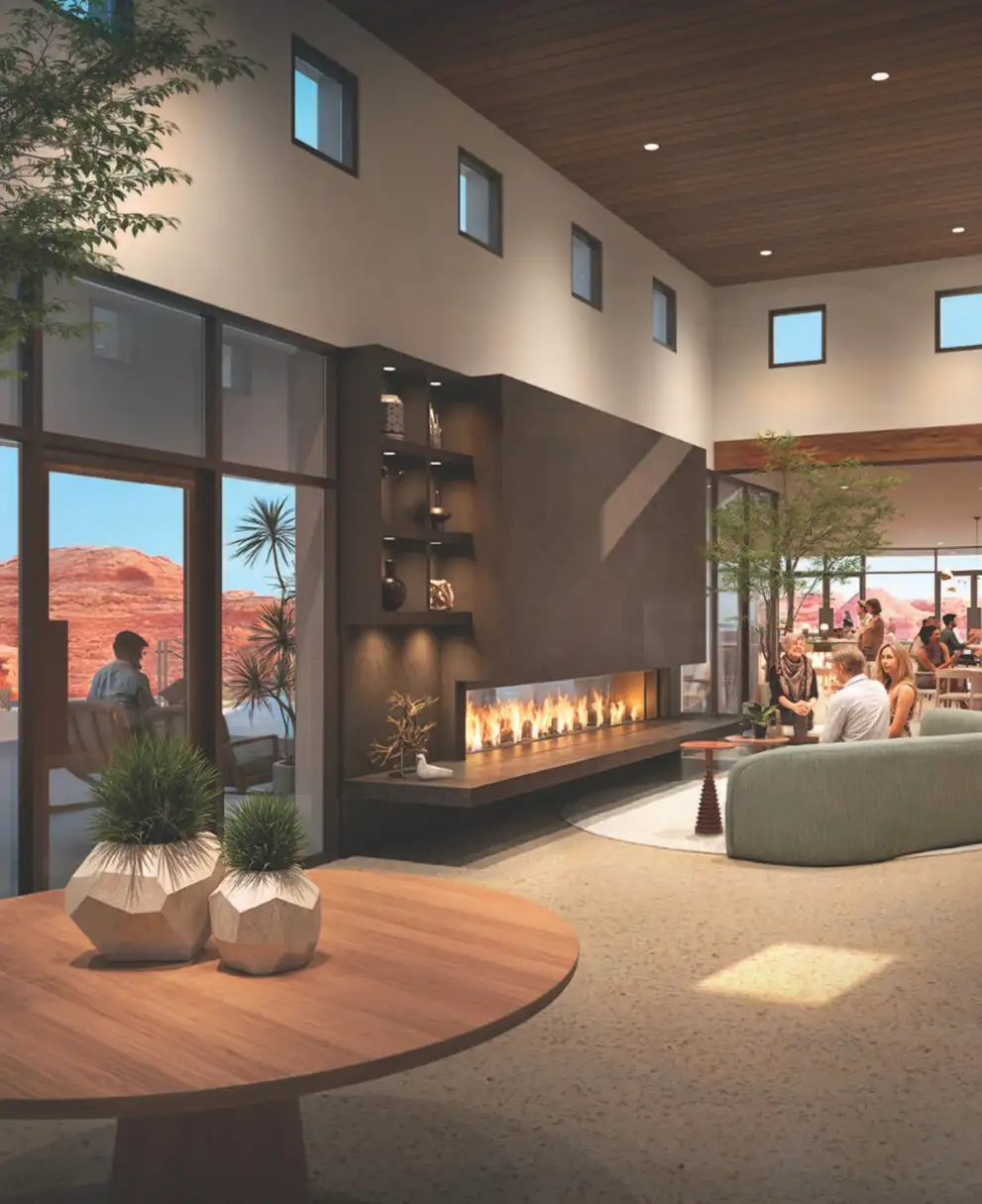 Solente clubhouse lounge with a modern linear fireplace, wood ceiling, seating areas, and panoramic red rock desert views