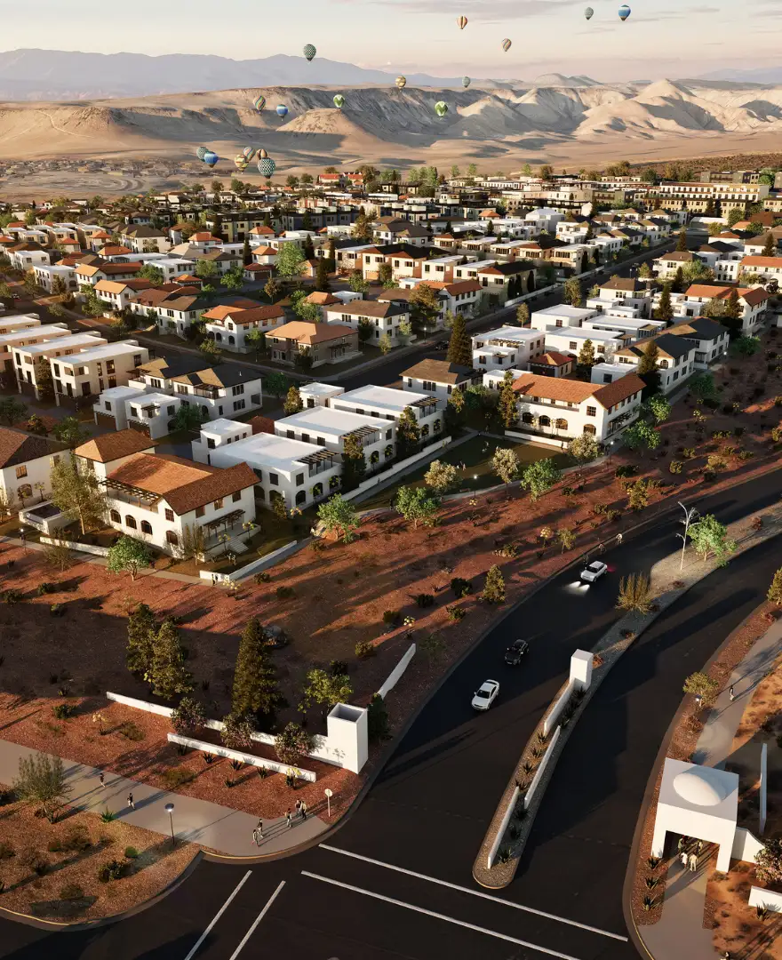 Aerial rendering of Solente master-planned desert community with Mediterranean-style homes, winding streets, and hot air balloons overhead