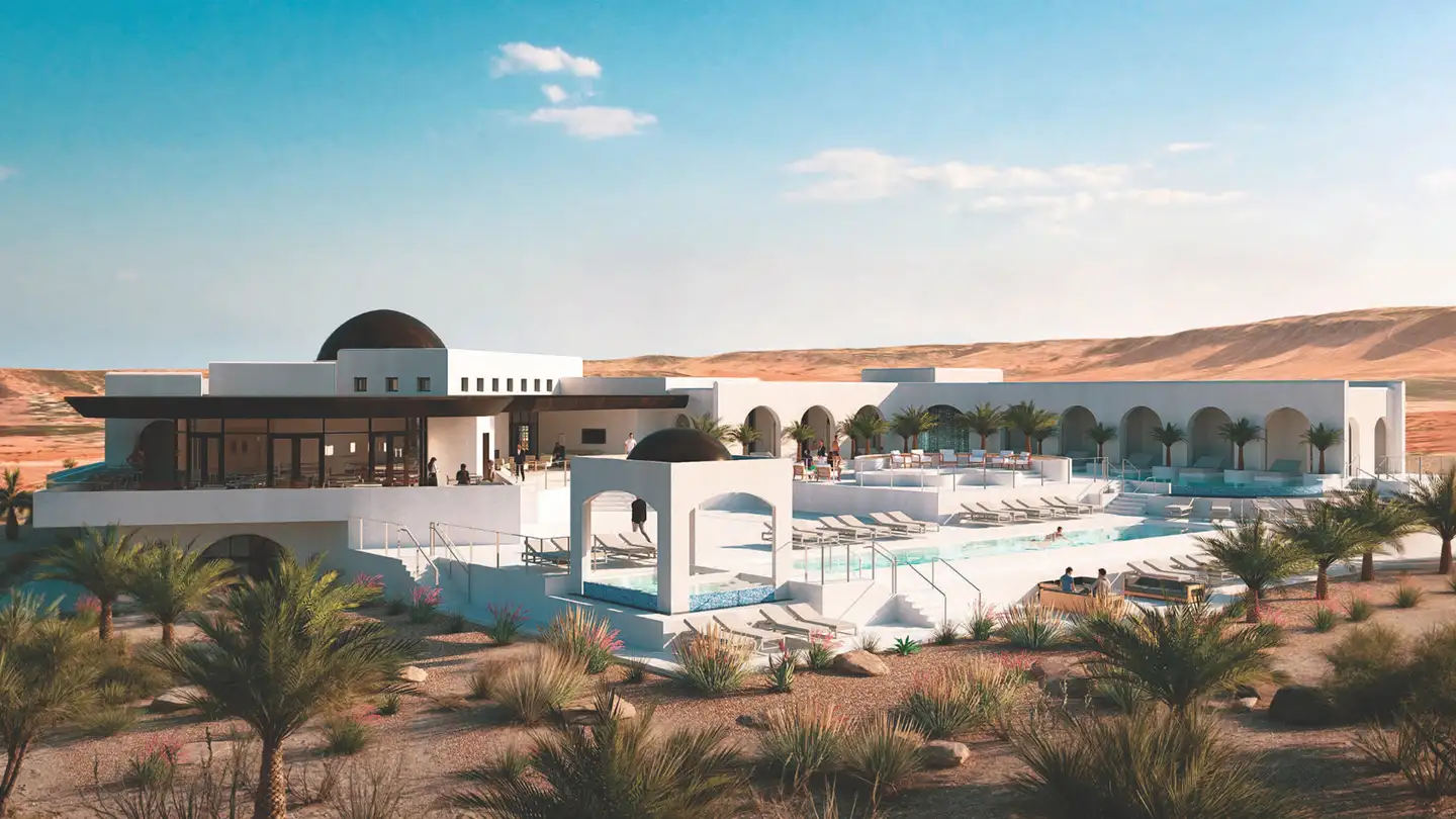 Aerial rendering of the Solente resort-style clubhouse with arched white architecture, swimming pool, and surrounding desert dunes