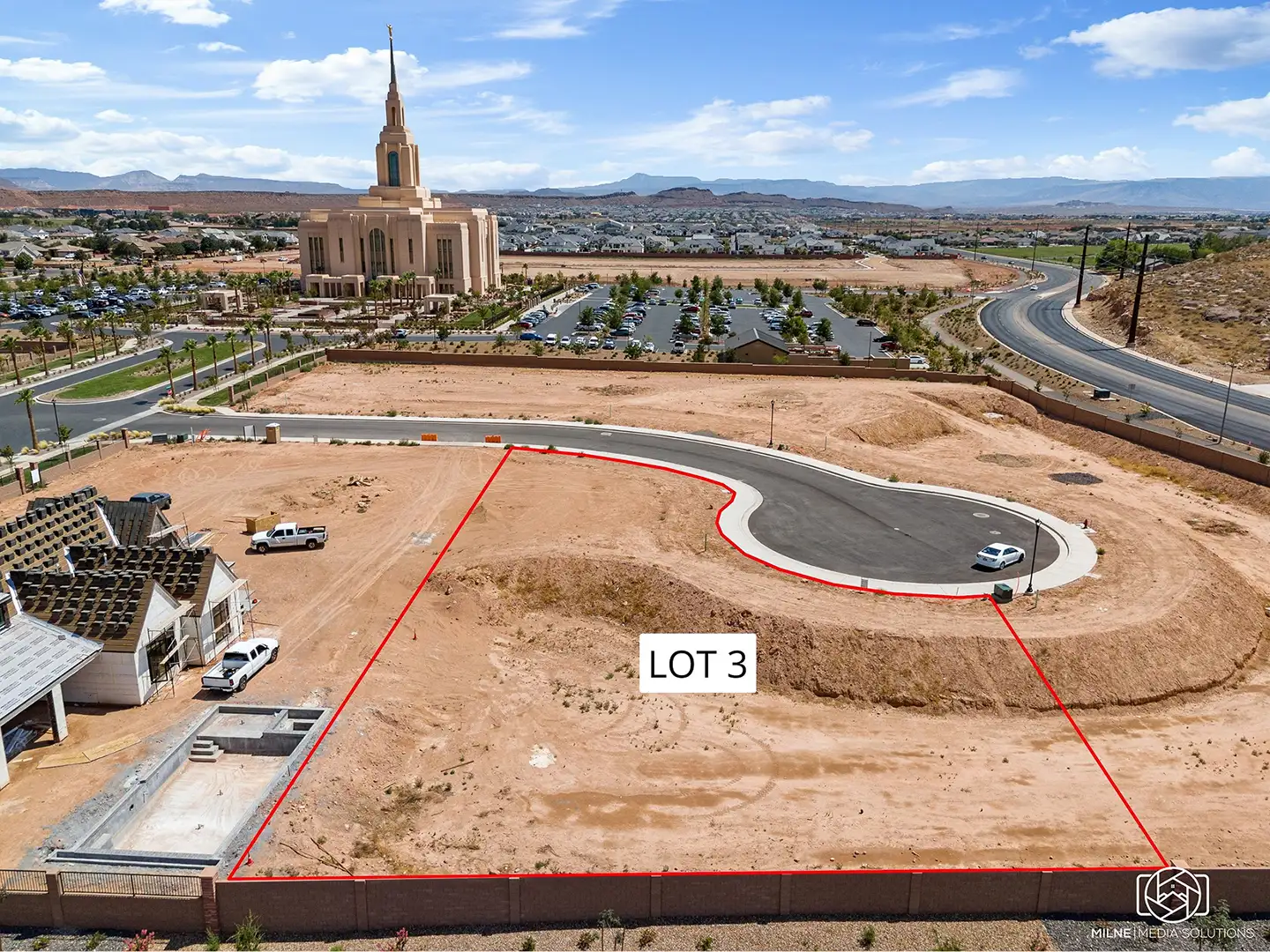 Aerial view of a home lot on a cul-de-sac looking south toward a temple, landscaped grounds, and surrounding neighborhoods