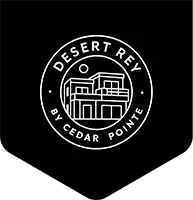 Circular "Desert Rey by Cedar Pointe" badge with modern home illustration on black pennant background.