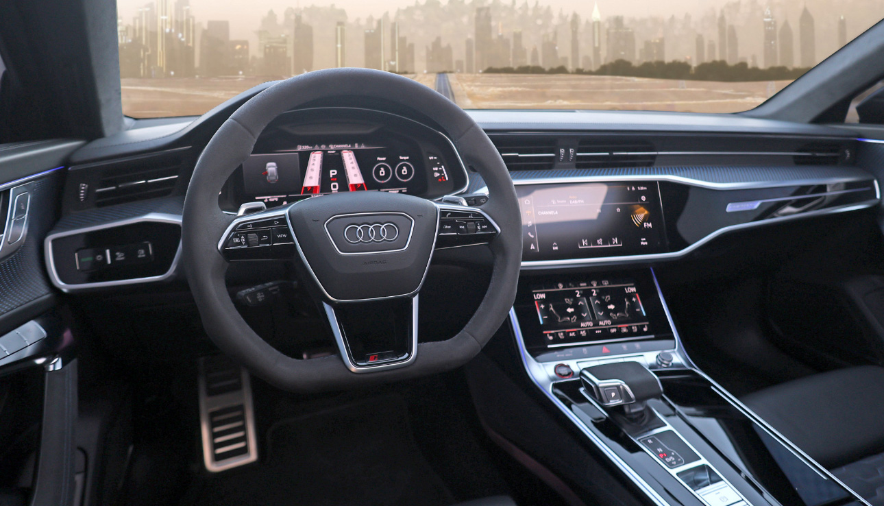 Modern Audi interior with digital dashboard and city skyline background