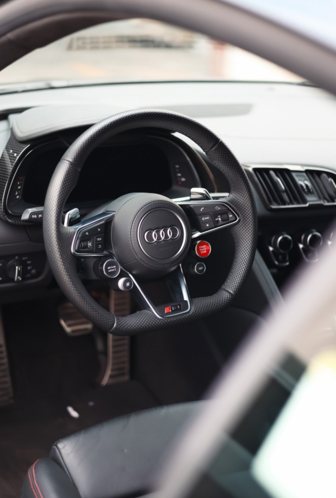 Audi sports steering wheel with dashboard and start button