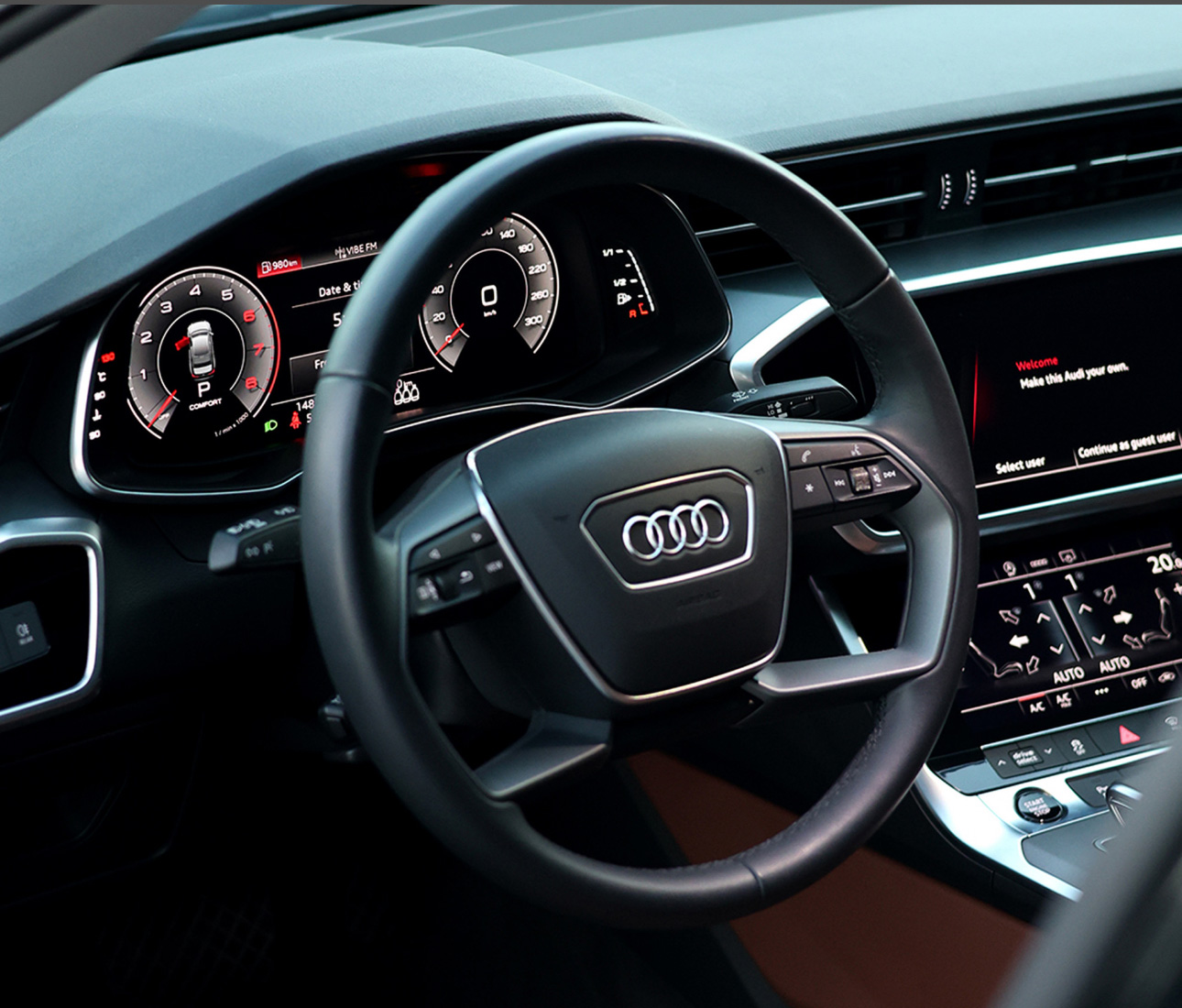 Modern Audi interior dashboard with steering wheel and digital instrument cluster