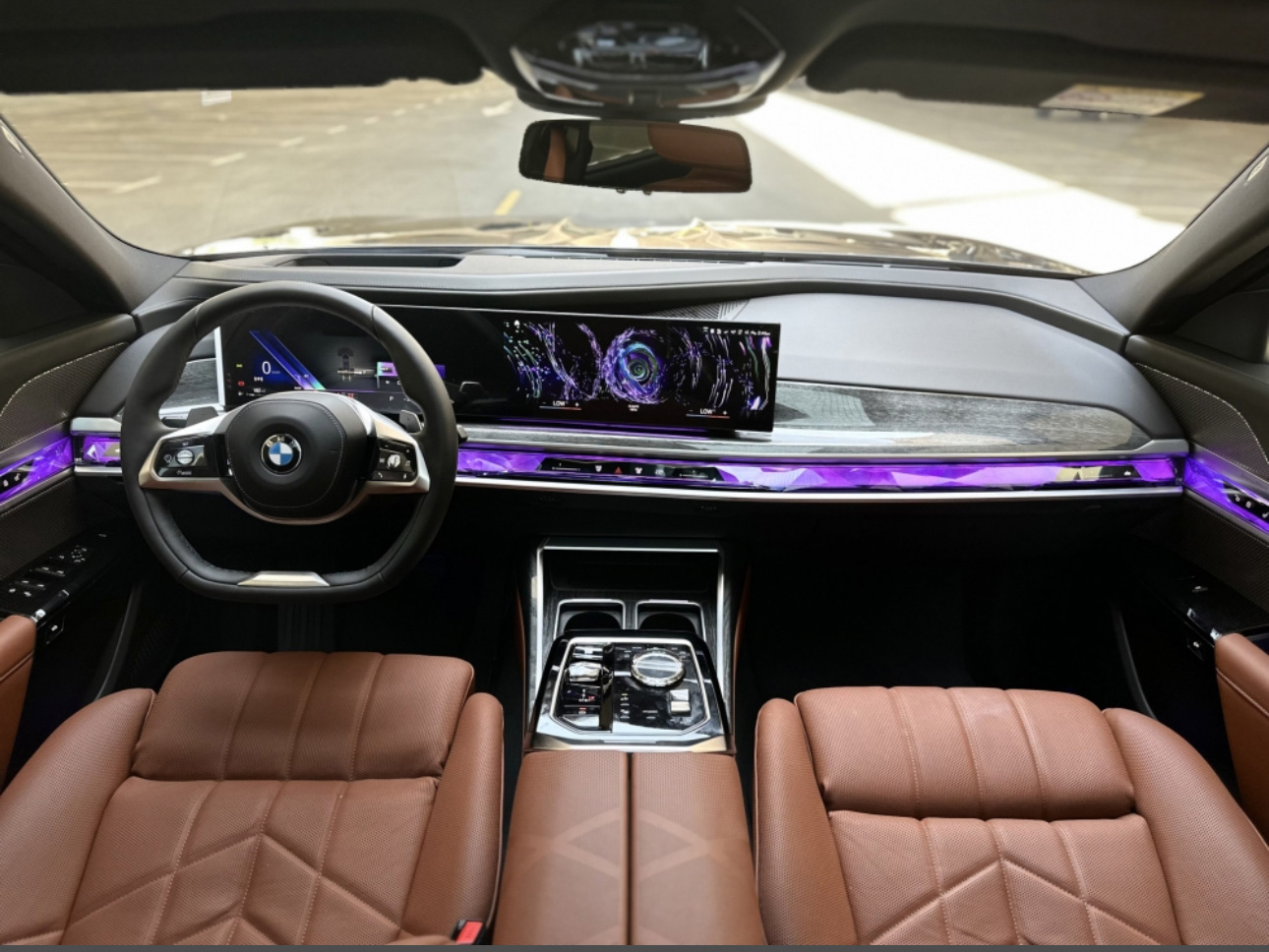 Luxurious BMW interior with purple ambient lighting and digital dashboard