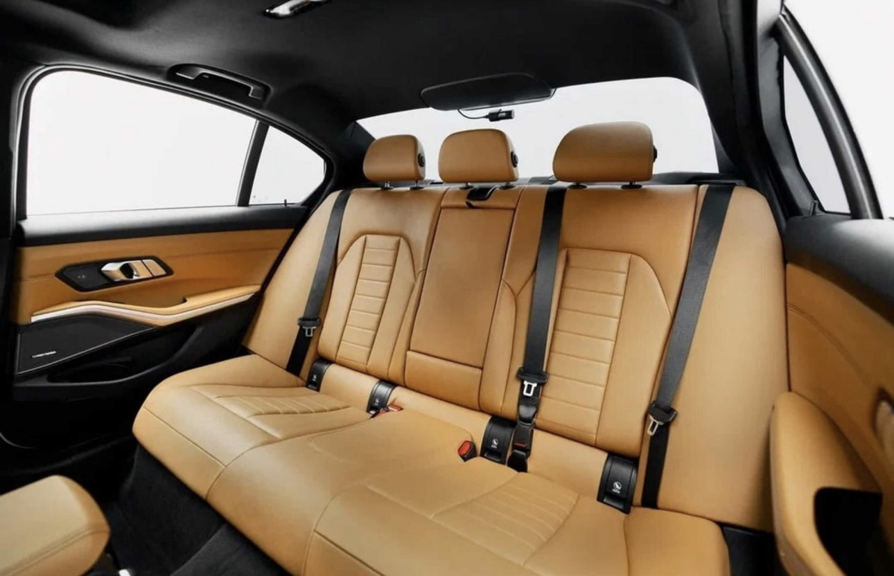 Luxury car interior with tan leather seats and black trim